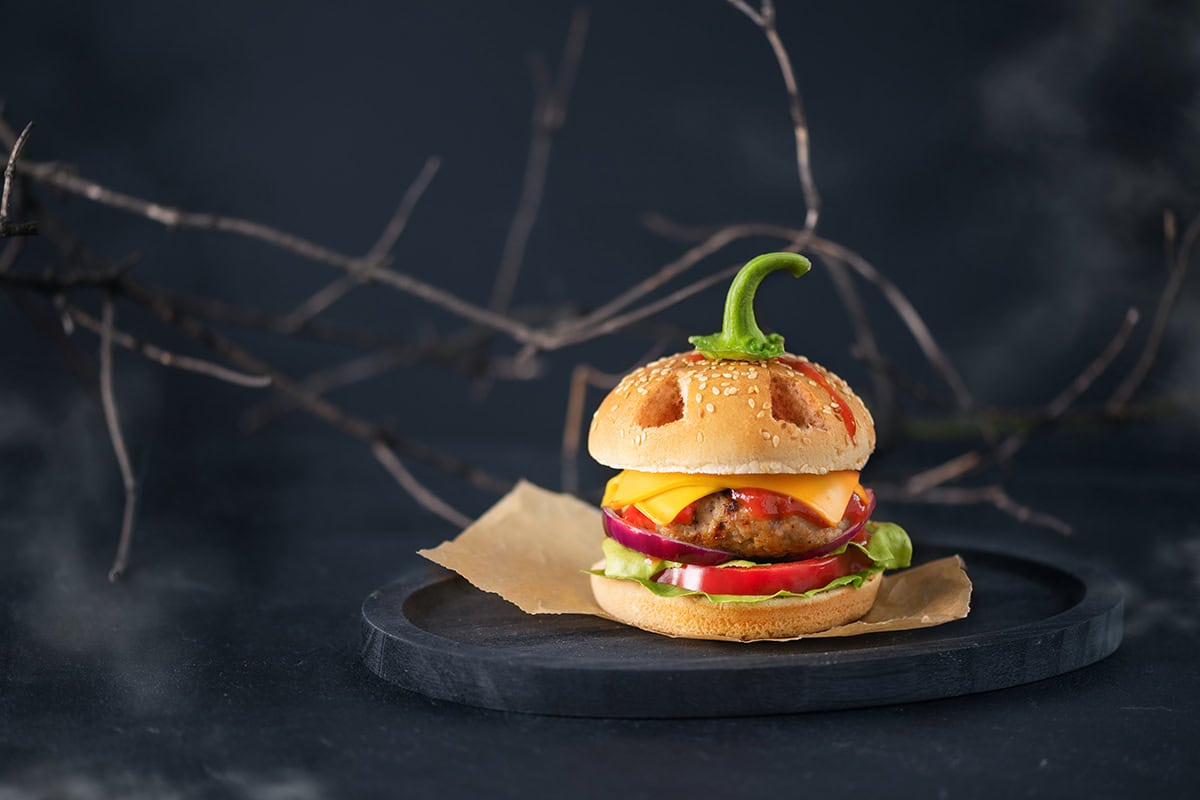 A Burger Wearing a Lantern Mask