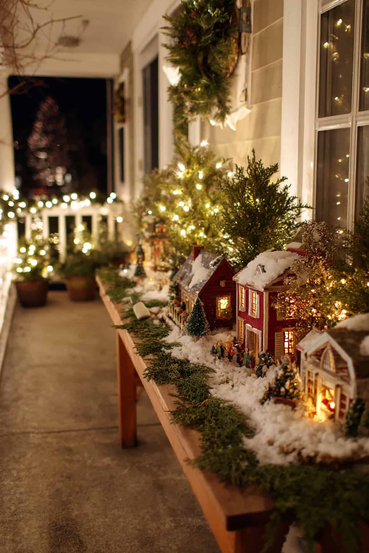 A Row of Little Houses on a Porch Table