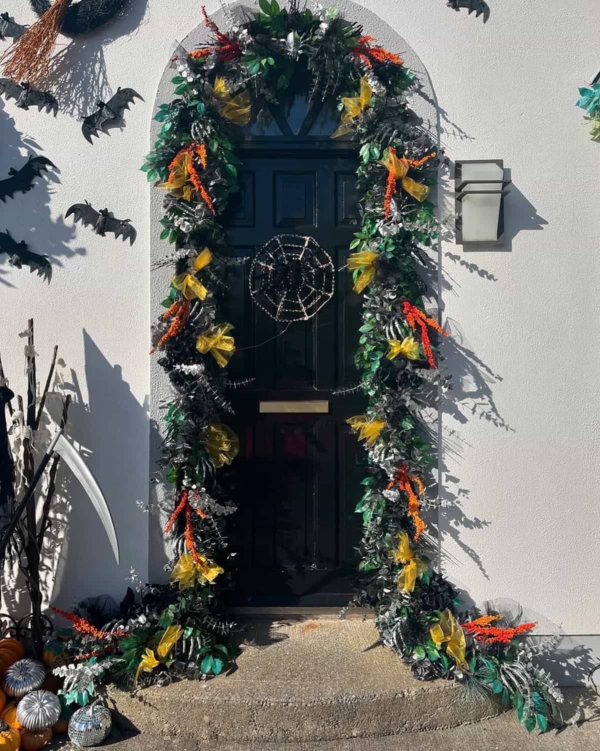 Black Door with Spiderweb Wreath