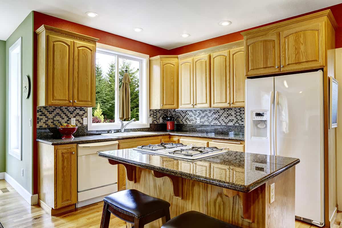 Warm Wood Cabinets with Granite Island