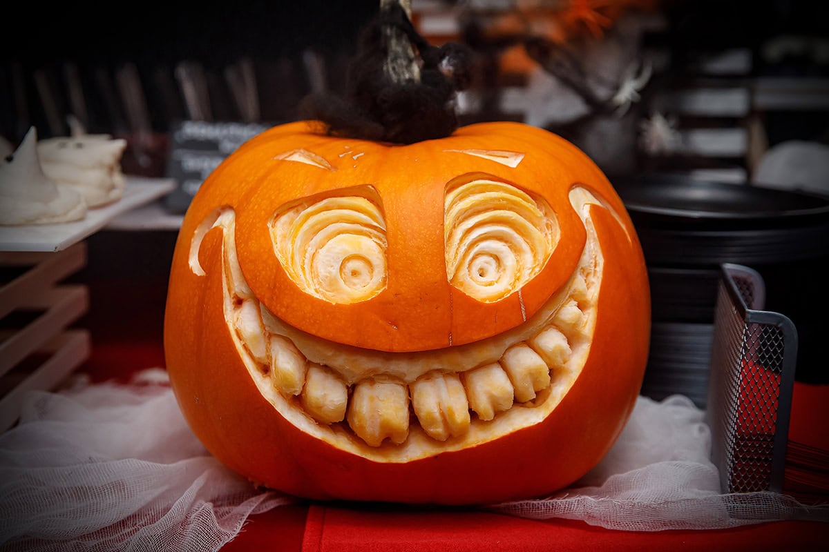 Wide Grin Pumpkin with Spiral Eyes