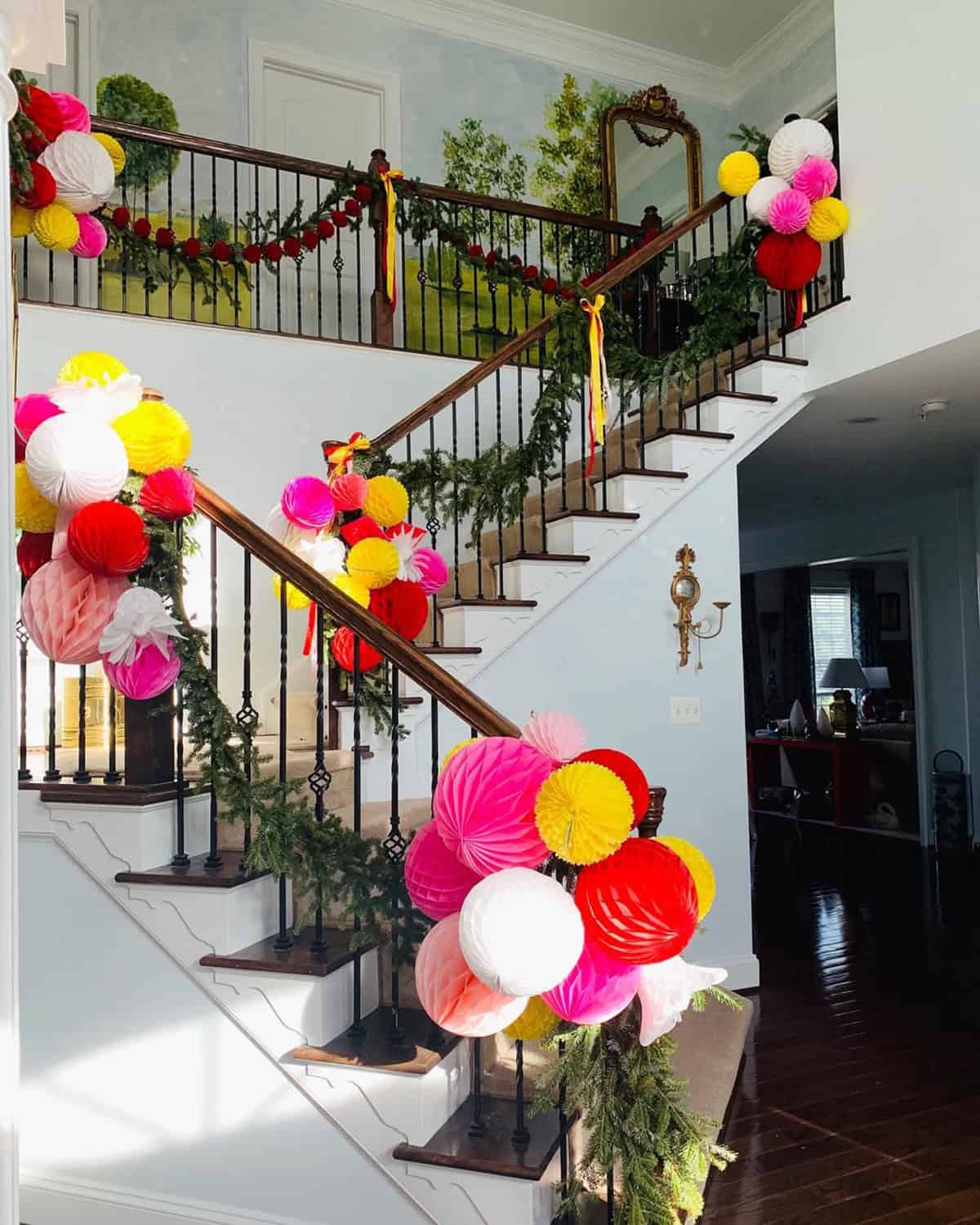 Bright Paper Ornament Staircase with Evergreen Garland