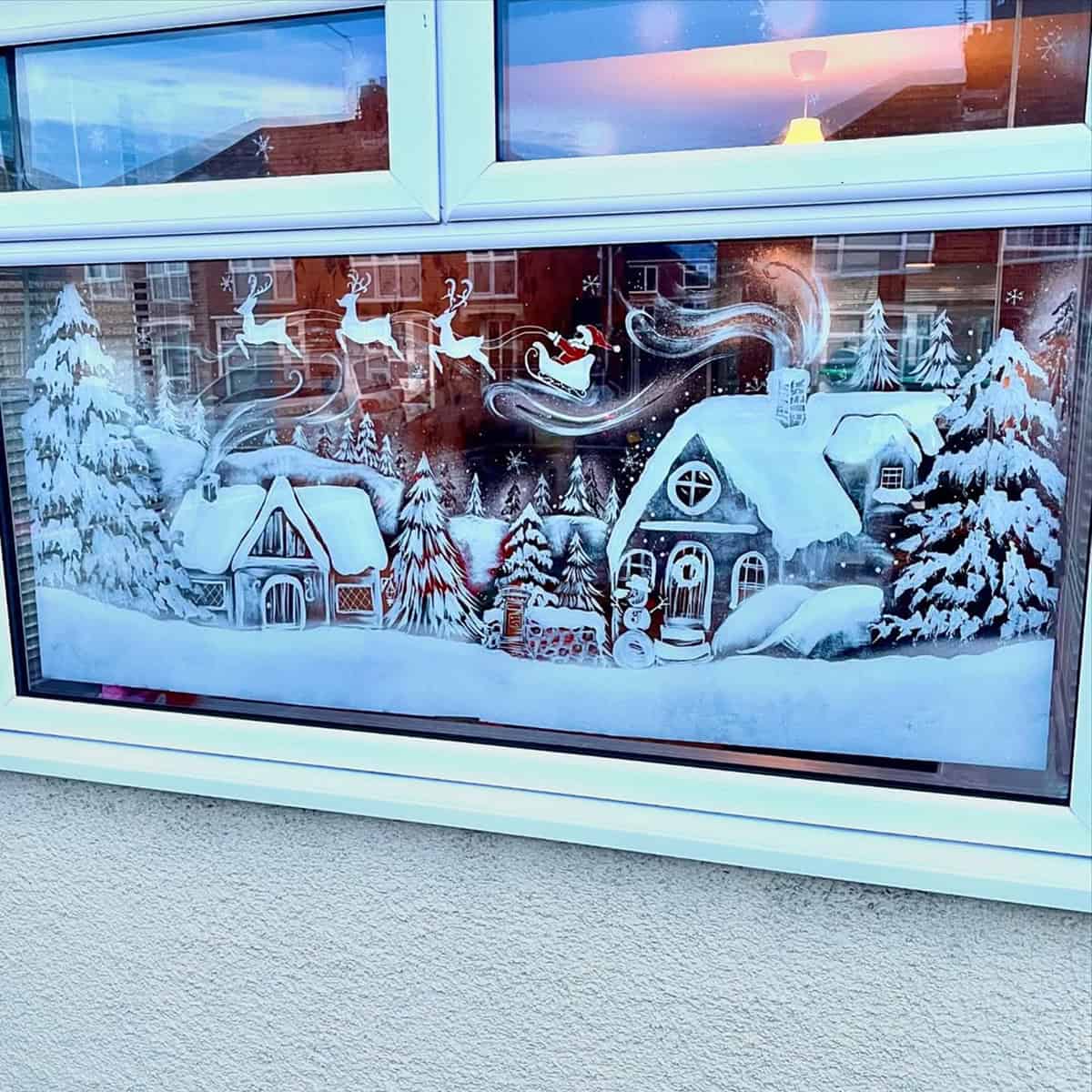 Cozy Snow Village with Santa’s Sleigh