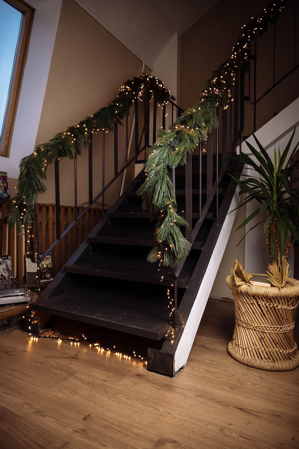 Iron Staircase with Pine Garland and Warm Lights