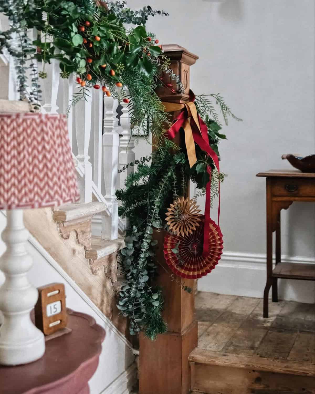 Loose Greenery and Linen Ribbon on Wood Stairs