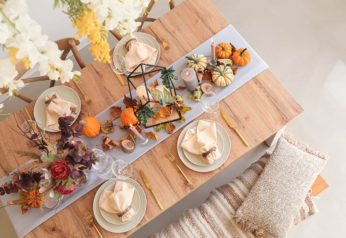 Pumpkins and Warm Neutrals on a Wooden Table