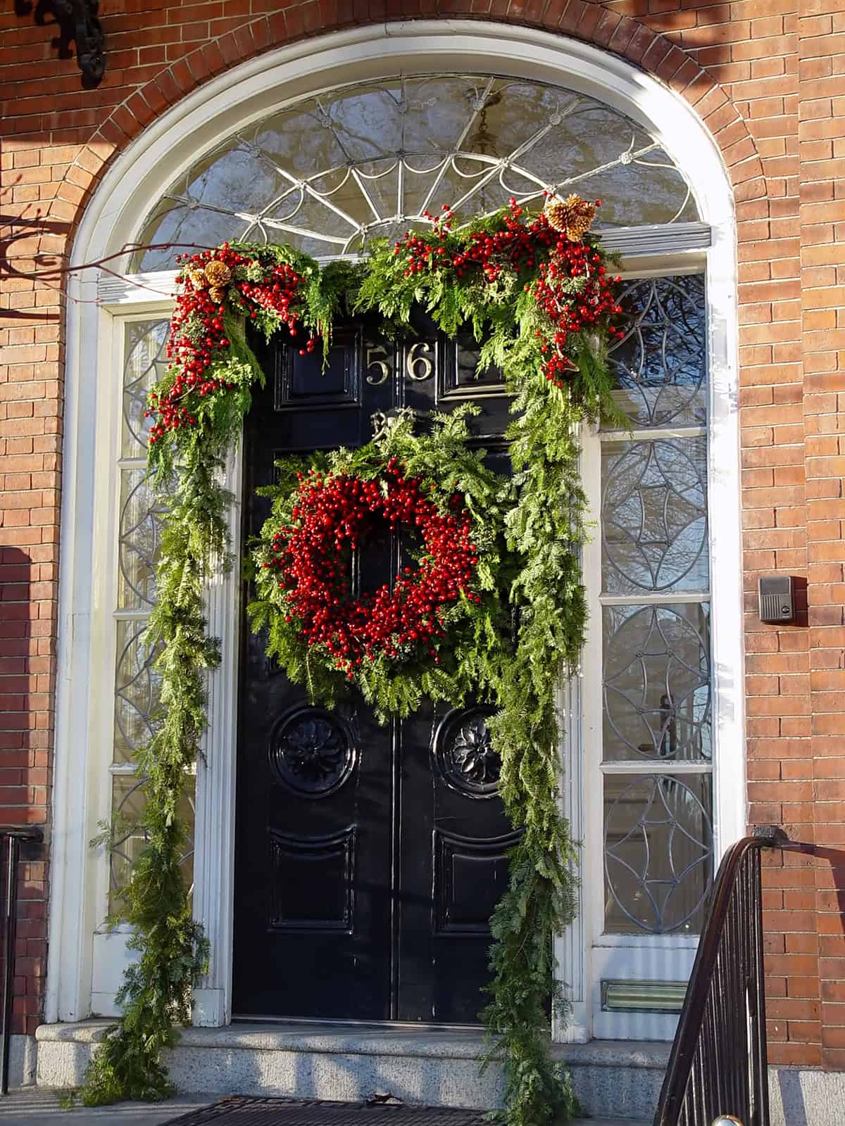 Timeless Red Berry Garland Around a Black Door