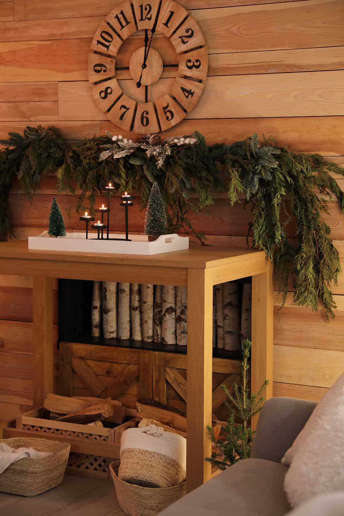Wood Console with Green Garland and Candlelight