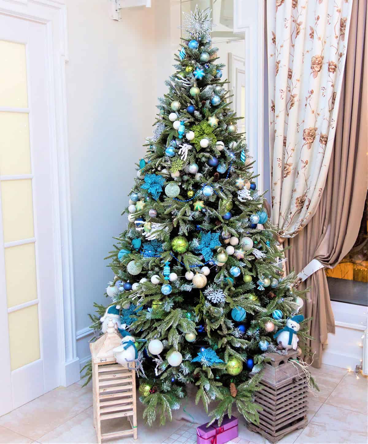 A Blue Green Mix Beside Tall Curtains