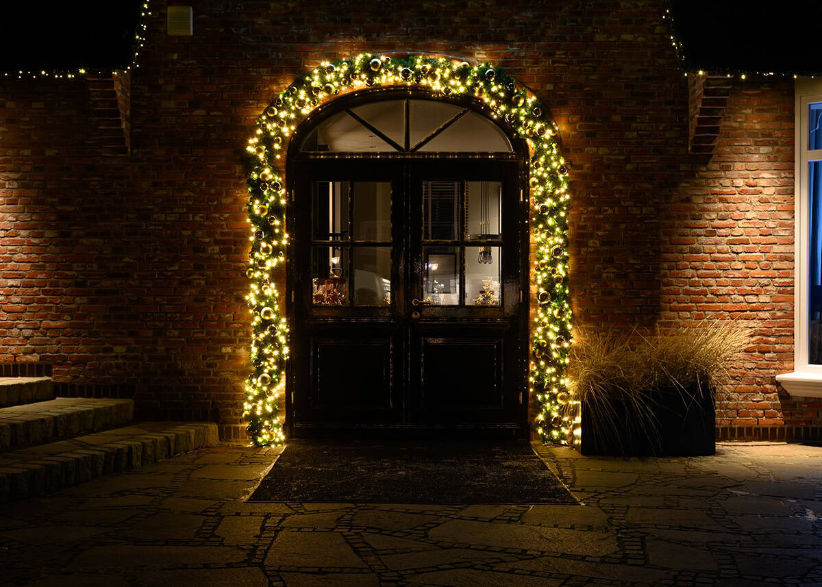 Arched Doorway Wrapped in Golden Lights