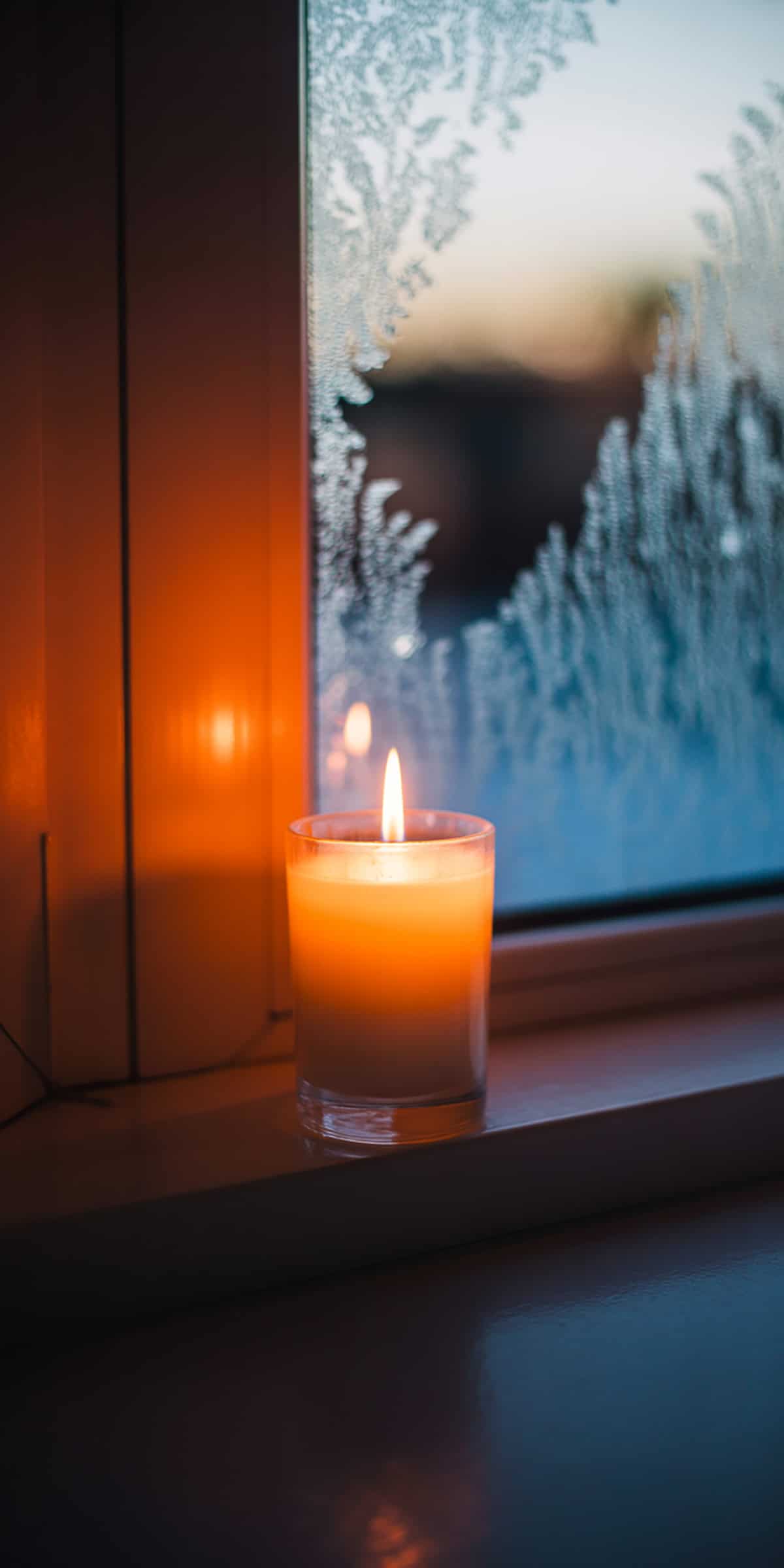 Candle Flame with Frosted Window Behind