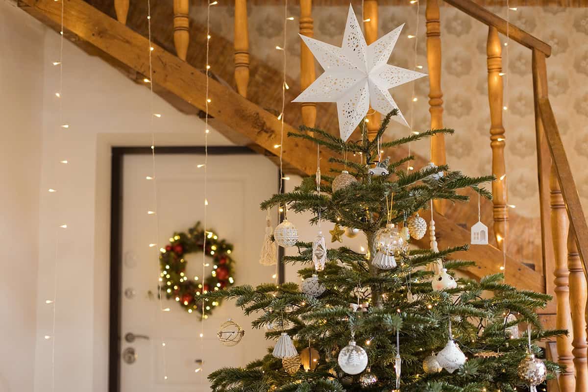 Cottage Entry Tree with Paper Star and Warm Staircase Lights