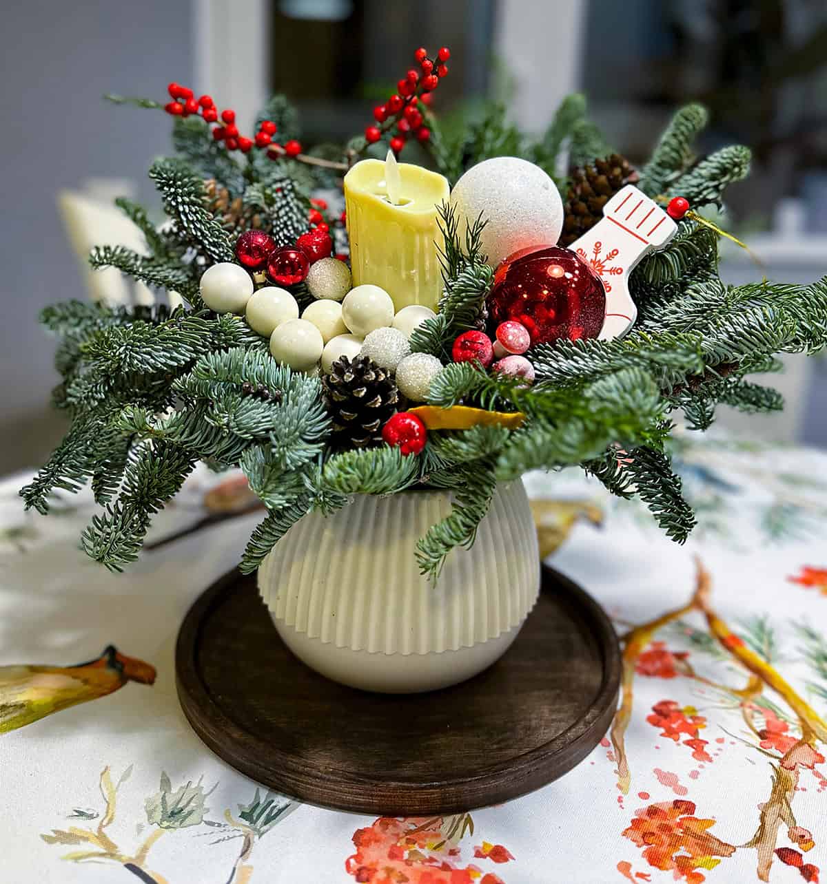 Cream Candle and Evergreen Vase Arrangement