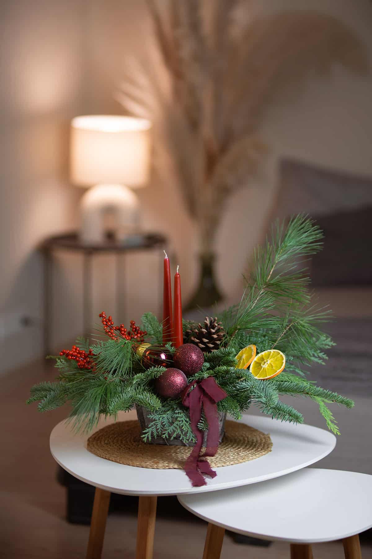 Evergreen and Candle Christmas Arrangement