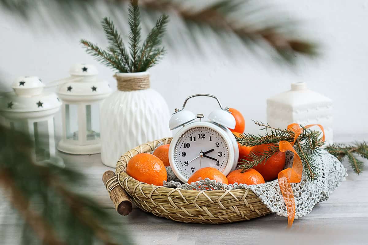 Fresh Citrus Tray with Pine Branches and Clock
