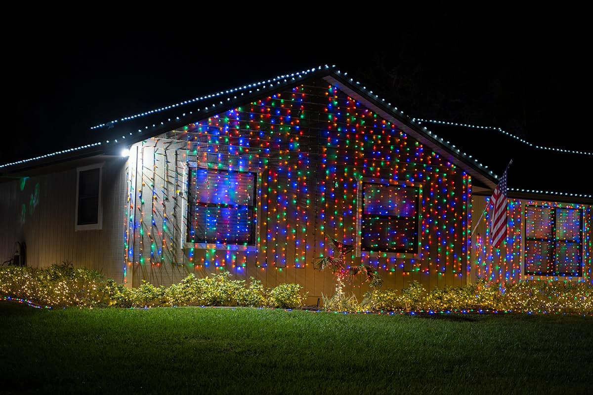 House Covered in a Curtain of Multicolor Lights