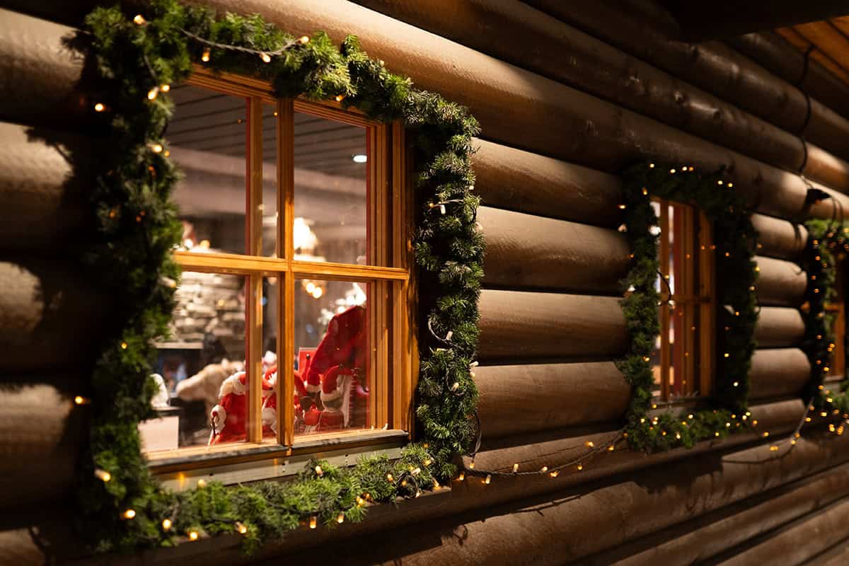 Log Cabin with Window Garland and Warm Glow