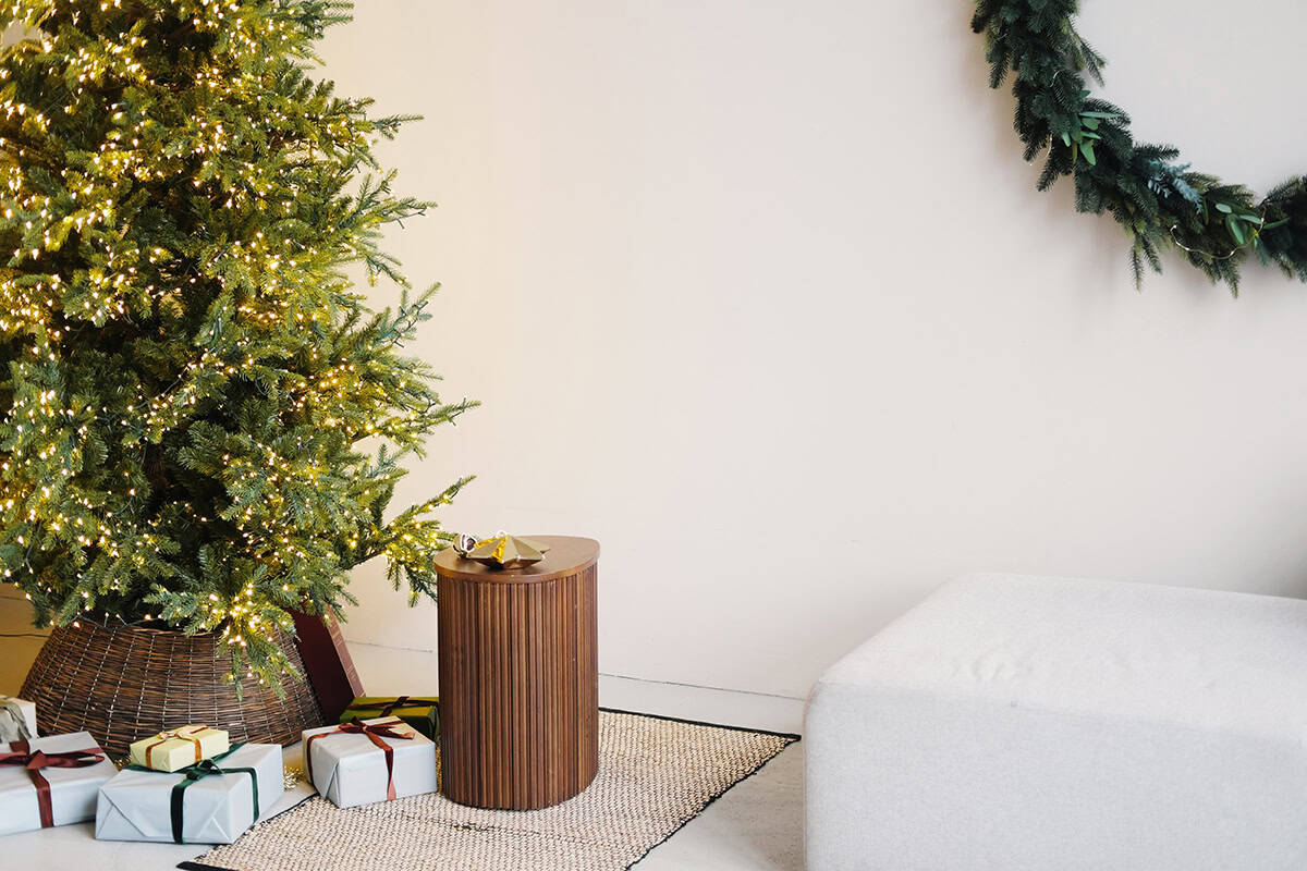 Minimal Living Room with a Lit Tree and Bare Wall Space