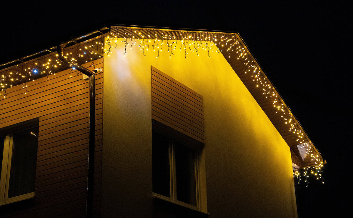 Warm Icicle Lights Along the Roofline