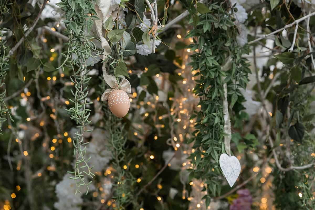 Green Vine Wall with Lights and Ornaments