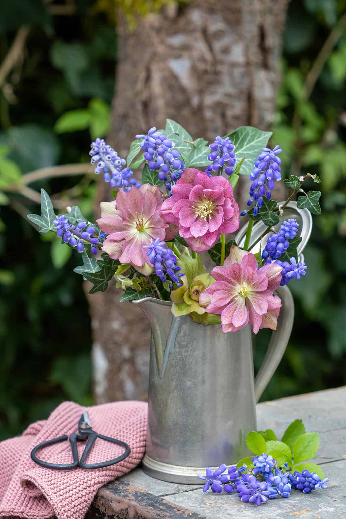 Lenten Roses and Hyacinths in a Weathered Pitcher