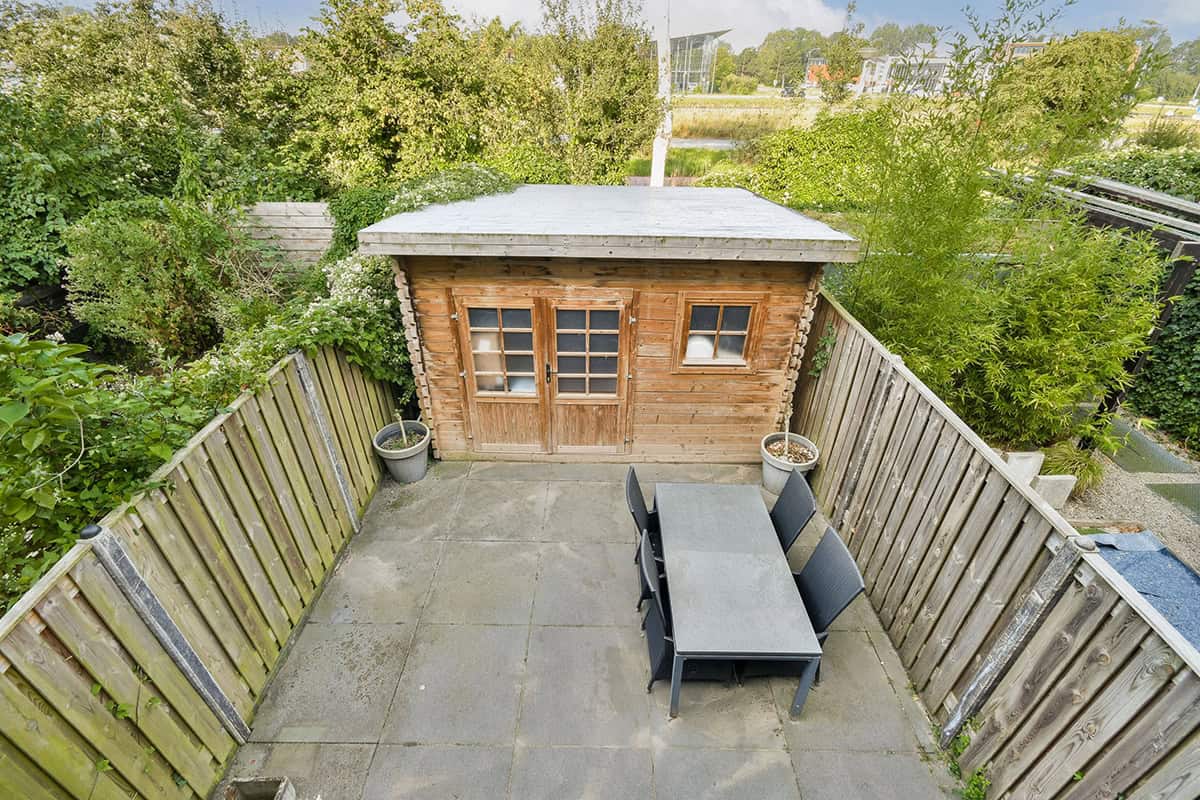 Wooden Garden Shed with Patio Table Area