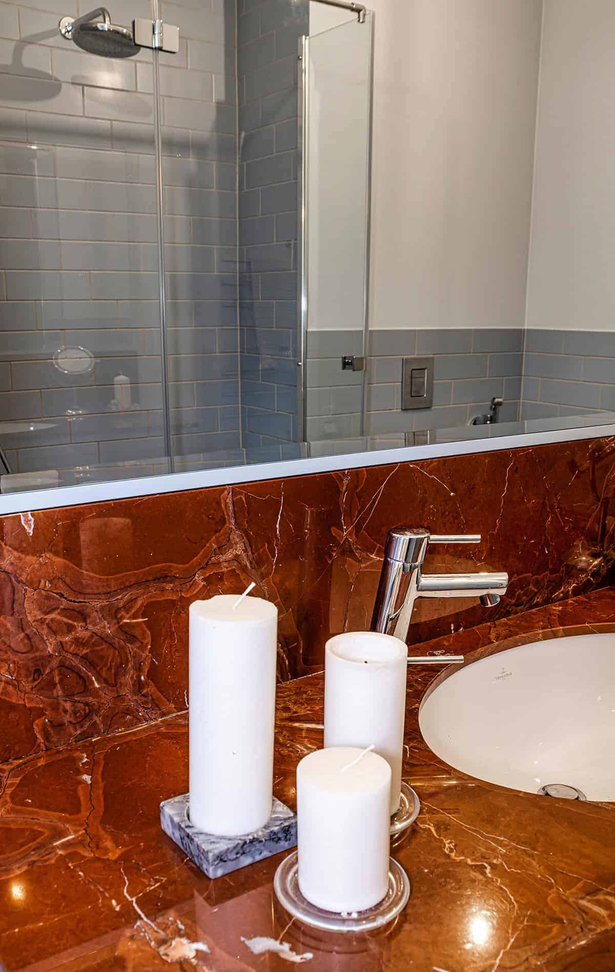 Candle Cluster Styling on a Bold Brown Marble Countertop