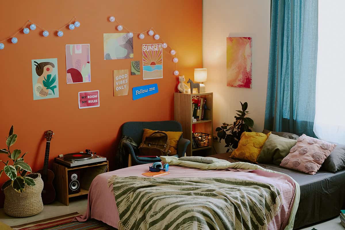 Orange Accent Wall with Poster Mix