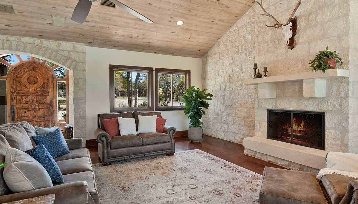 Rustic Meets Soft Plush Seating on Stone Walls