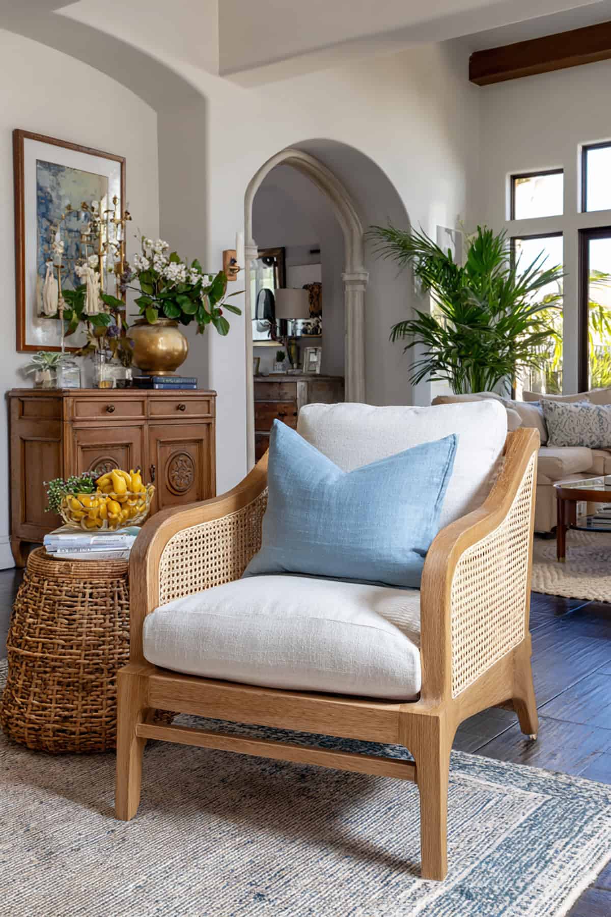 Cane Furniture with Light Wood Finishes and Subtle Blue Accents