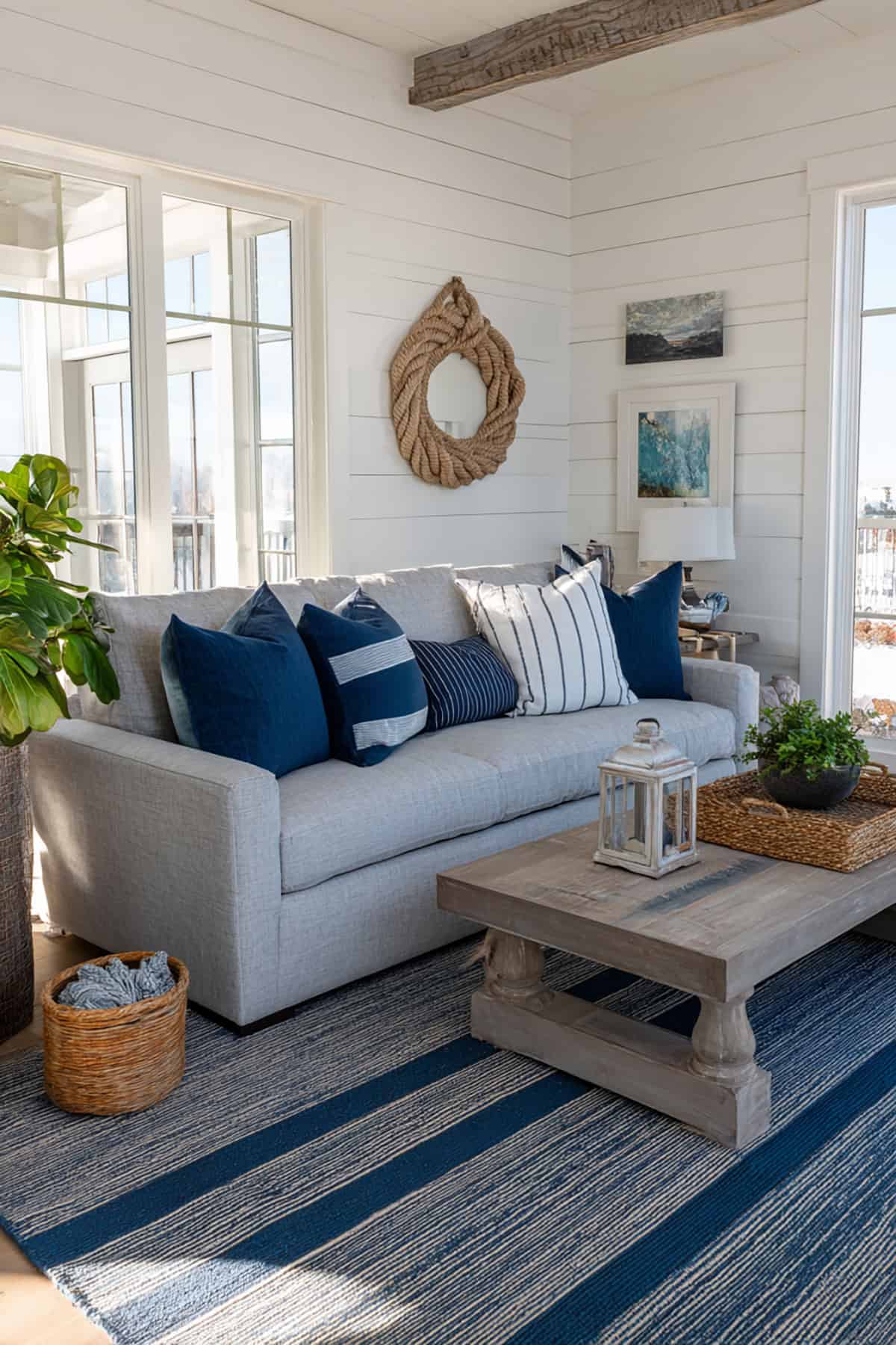 Shiplap Walls with Gray Sofa and Layered Nautical Decor Elements
