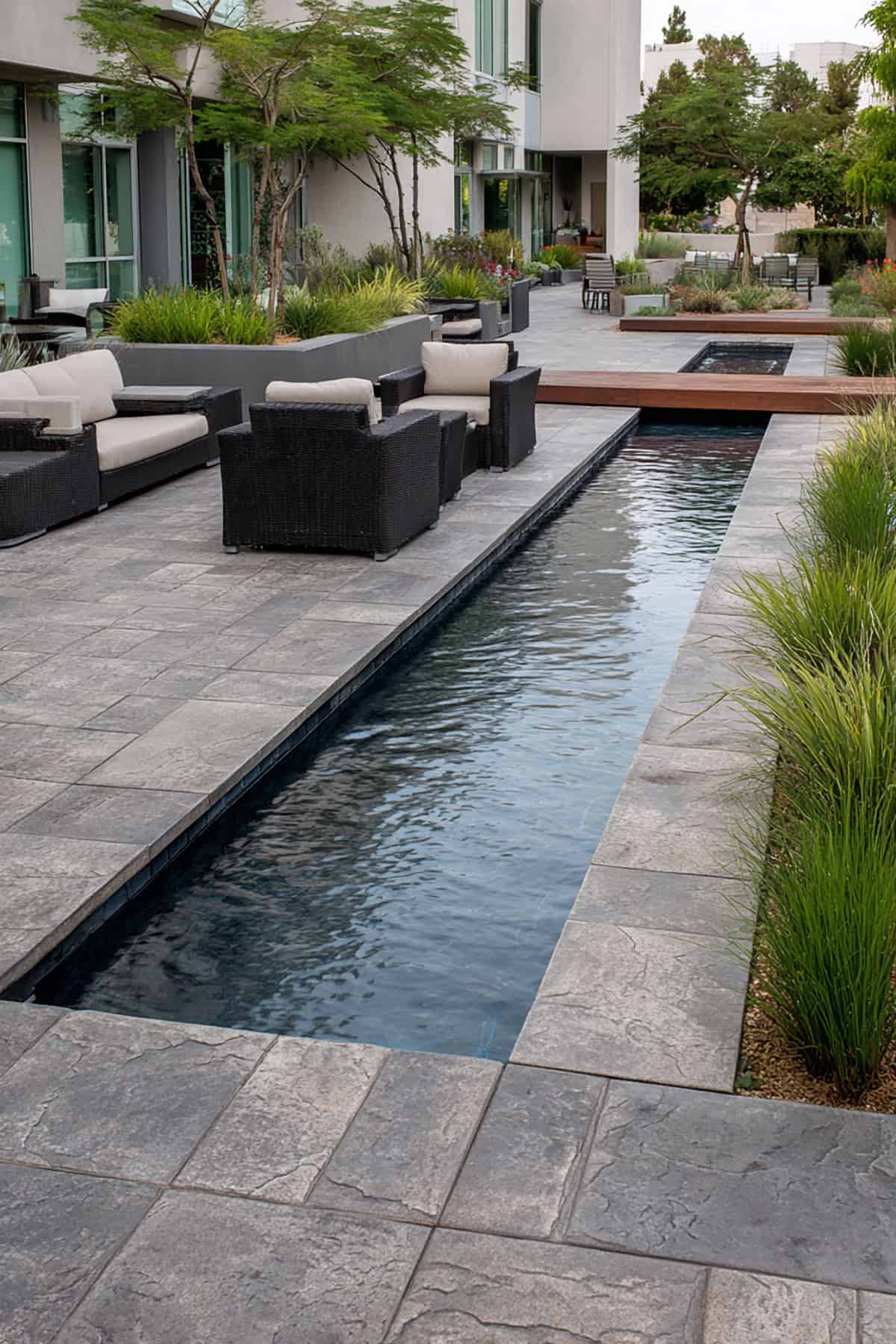 Ashlar Slate Stamped Patio with Water Rill Feature