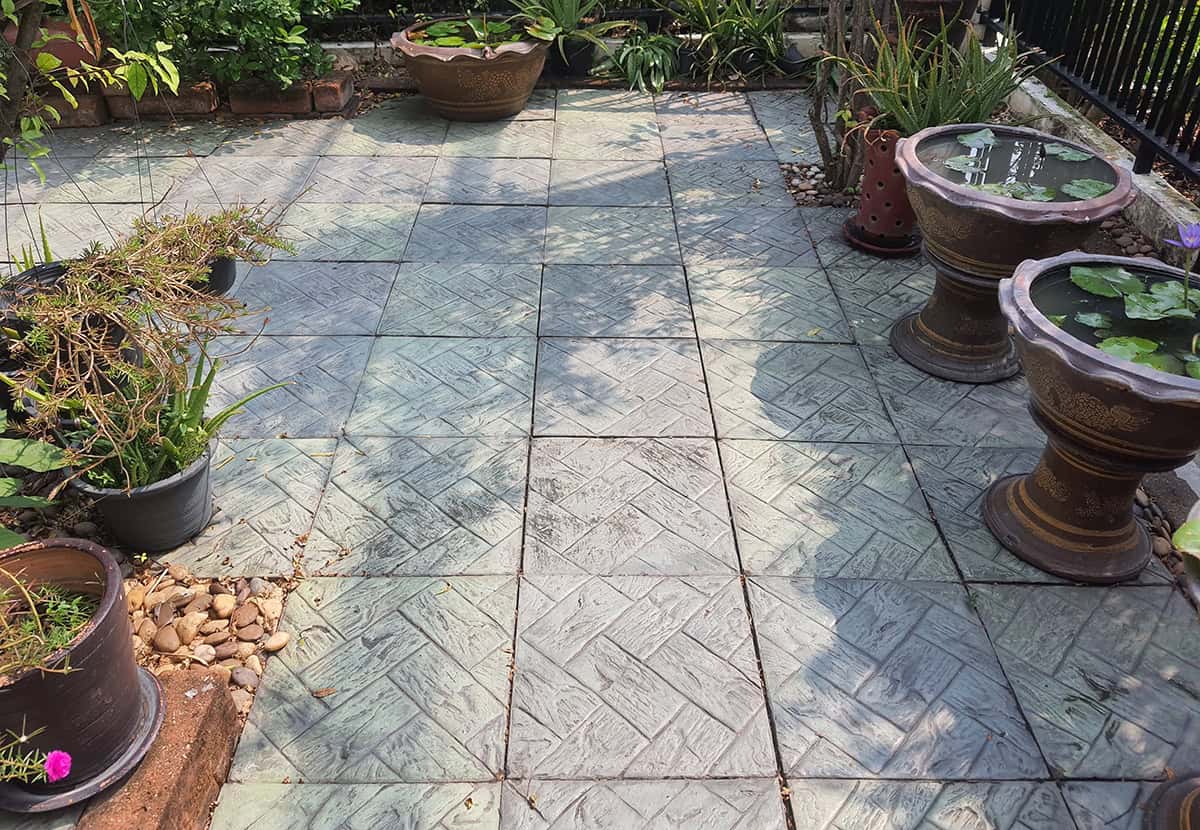 Grid Pattern Concrete Patio with Planters