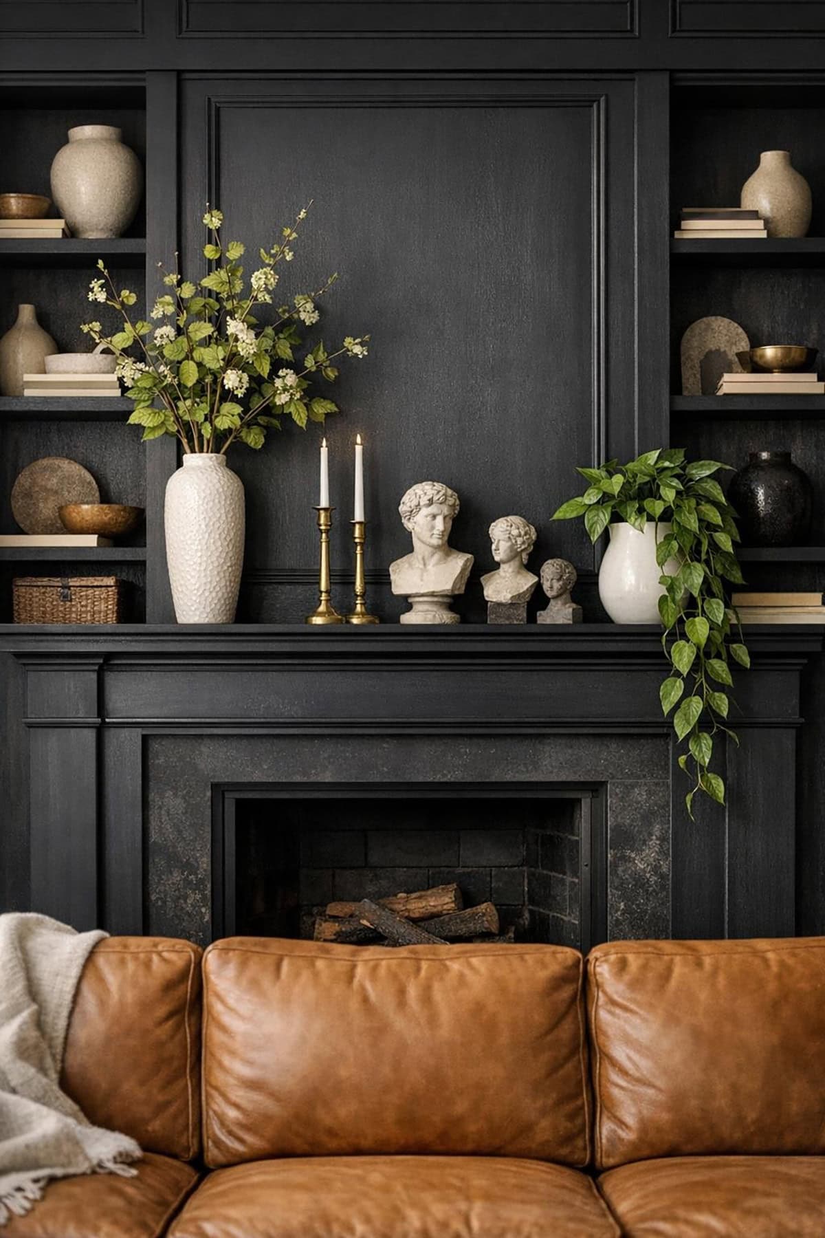 Moody Black Mantel With Greenery