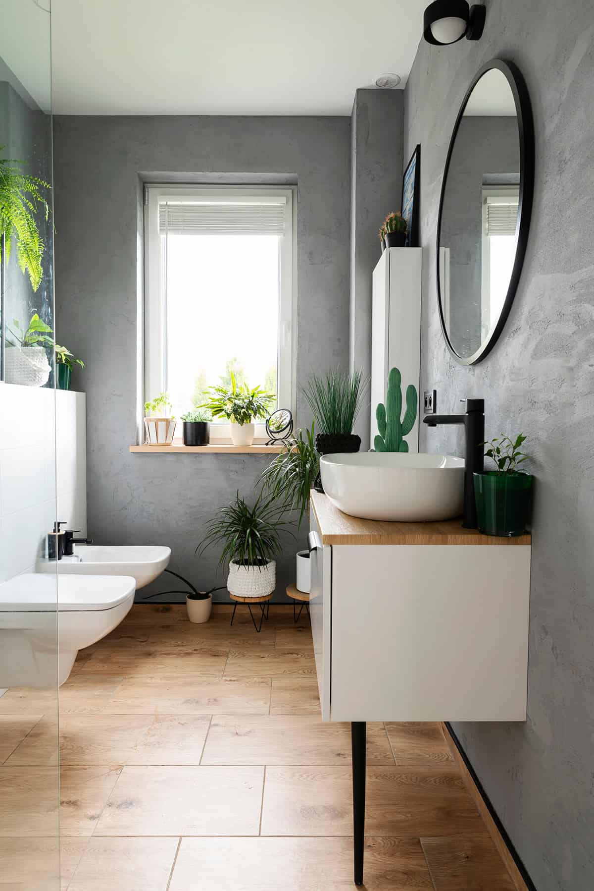 Nordic Bathroom with Green Plants and Gray Walls