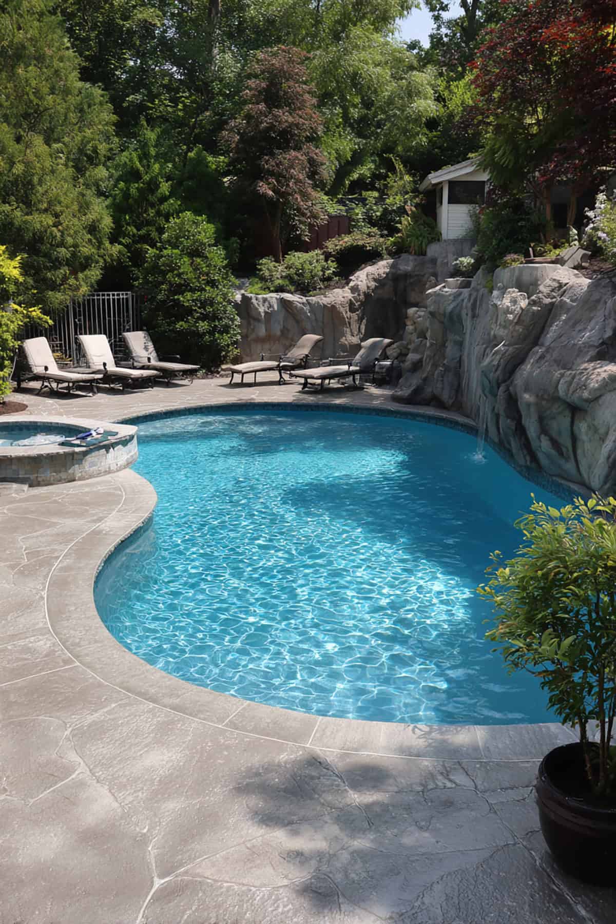 Poolside Stamped Concrete Patio with Raised Spa