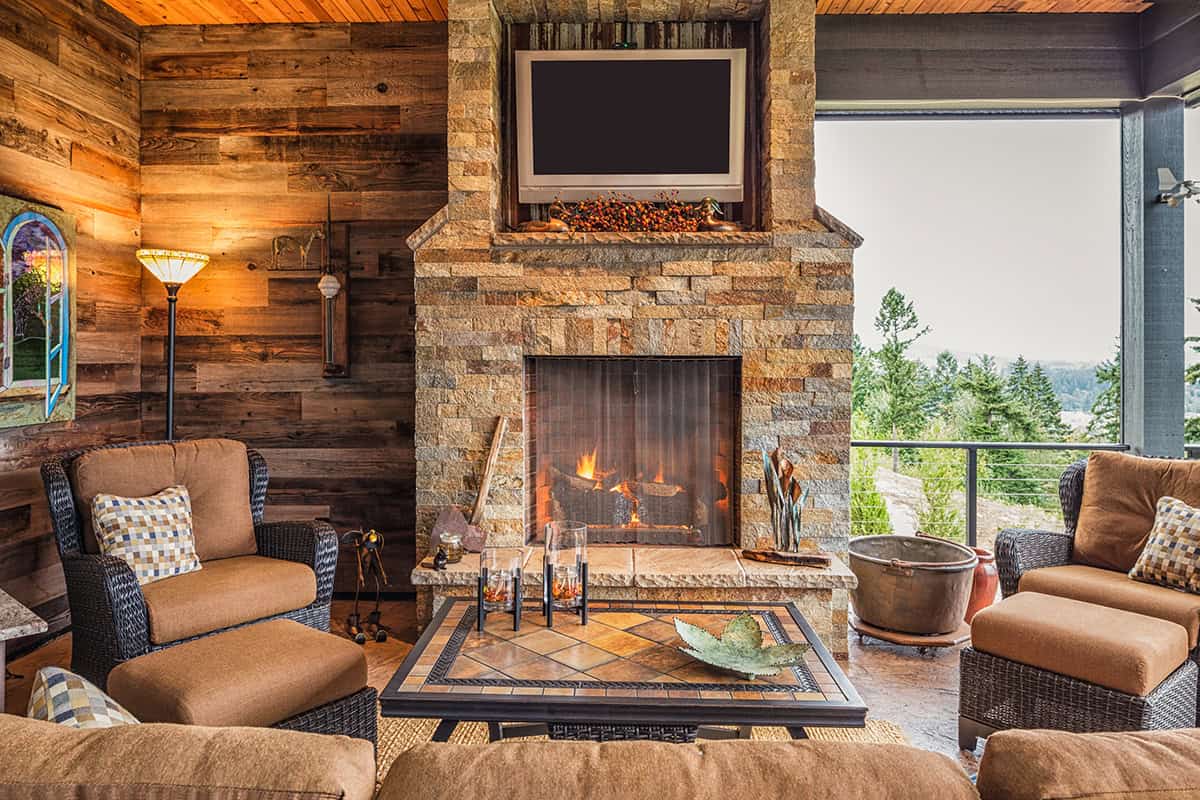 Rustic Lounge Setup with Back Porch Fireplace