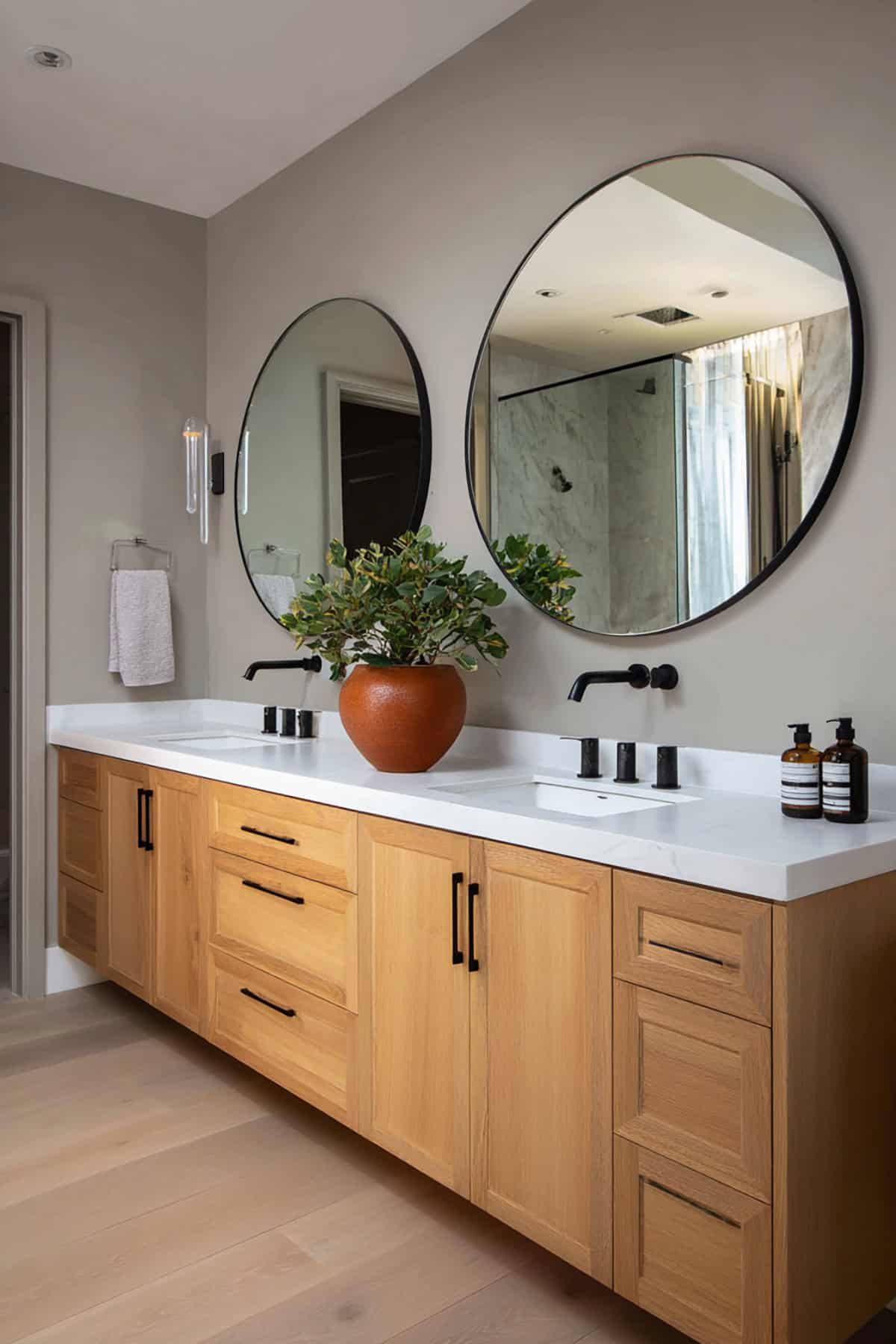 Scandinavian Bathroom with Double Round Mirrors