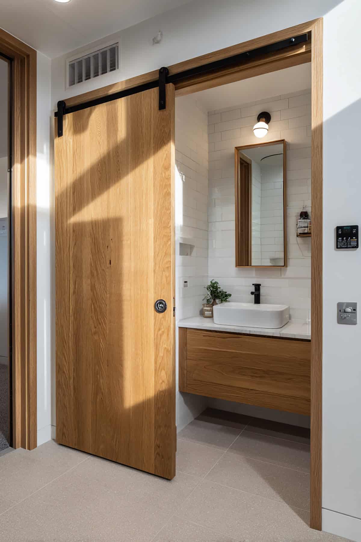 Scandinavian Bathroom with Sliding Wooden Door Entry
