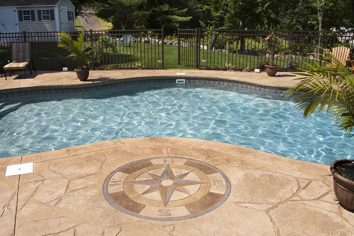 Stamped Concrete Pool Patio with Compass Inlay