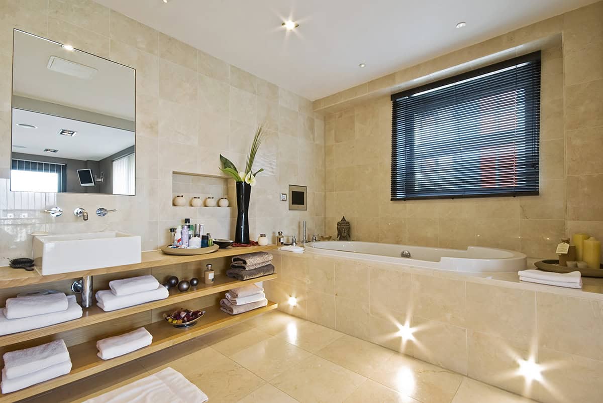 Warm Stone Spa Bathroom with Built In Tub and Floating Vanity