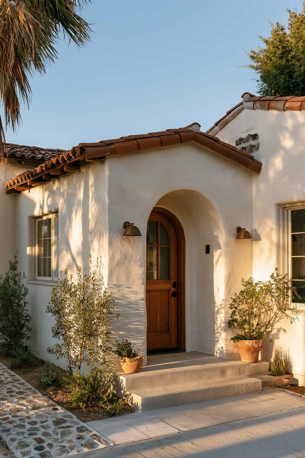 Bungalow With Arched Entryway and Mediterranean Influence