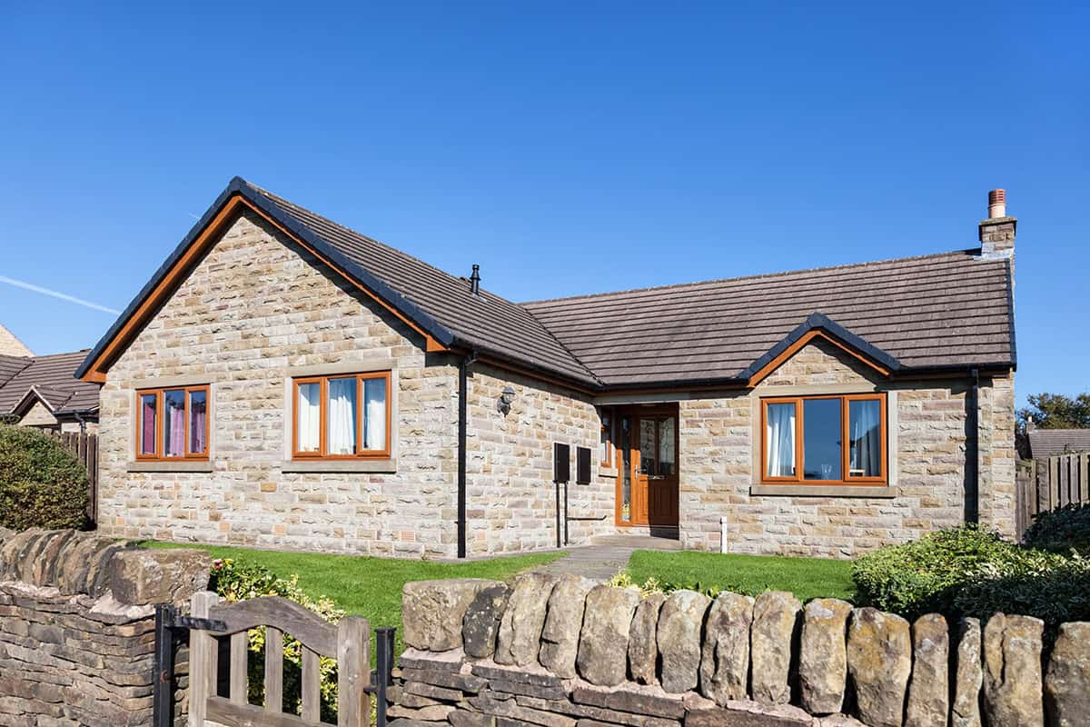 Cottage Style Stone Bungalow Exterior with Texture