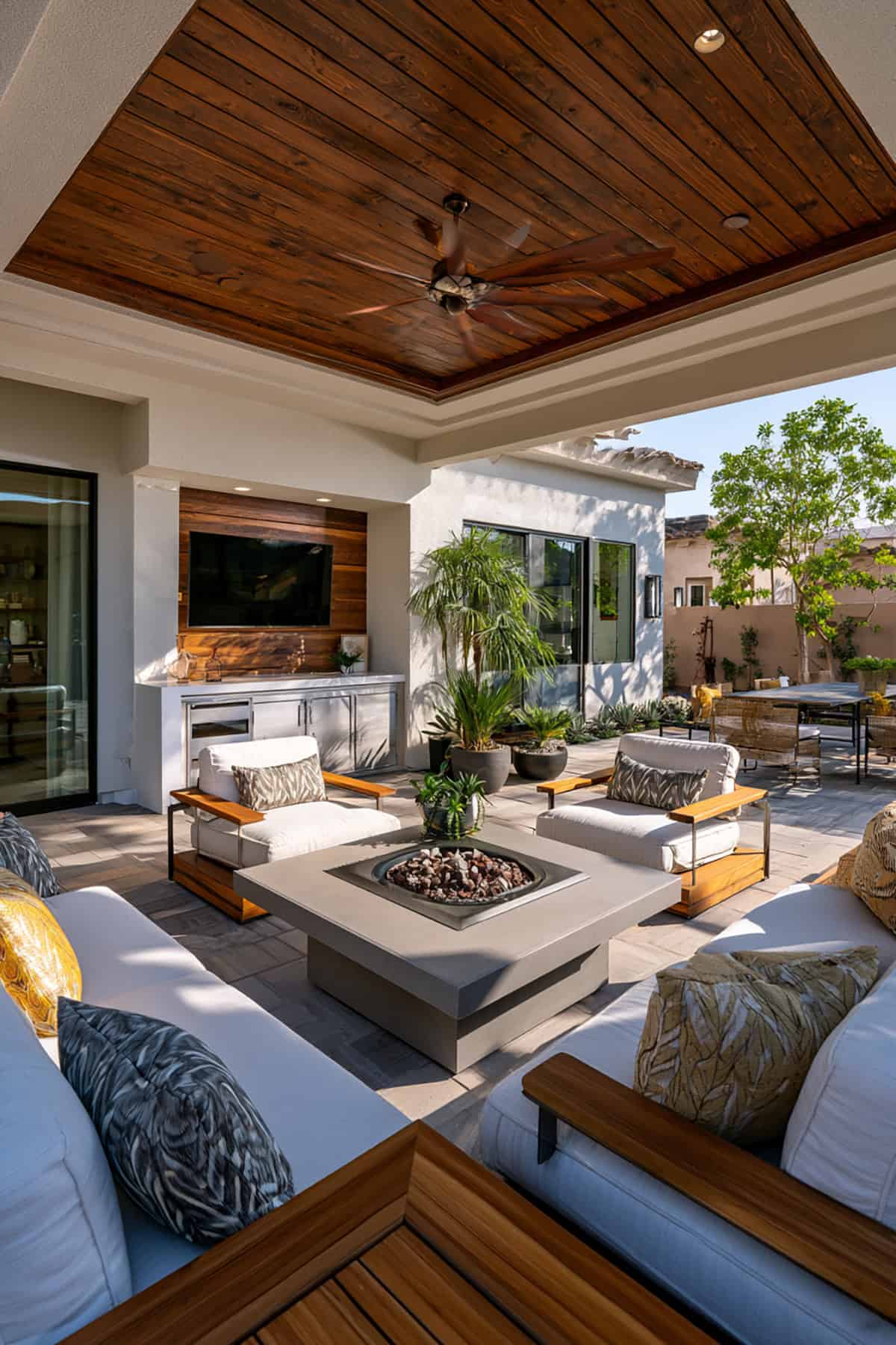 Covered Patio With Fire Table And Built In Storage Wall