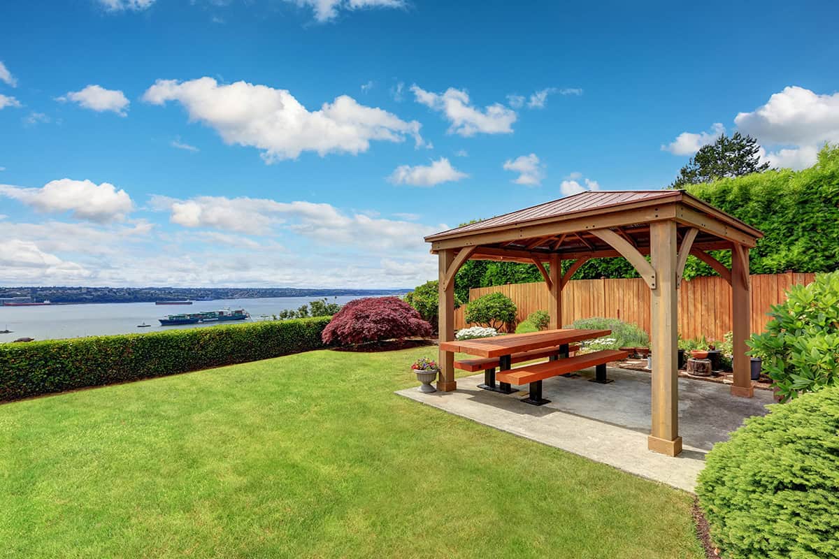 Covered Patio With Timber Gazebo And Scenic Lawn