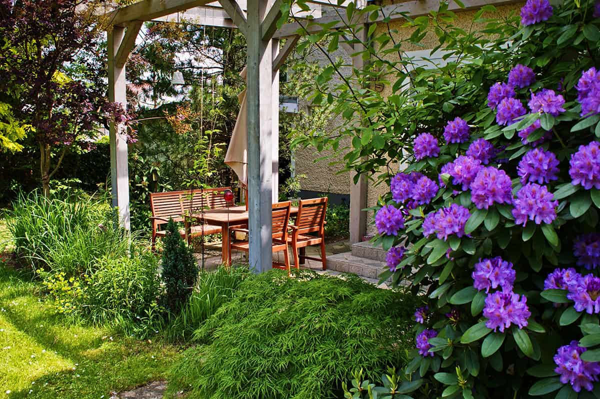 Garden Covered Patio With Wooden Table And Chairs