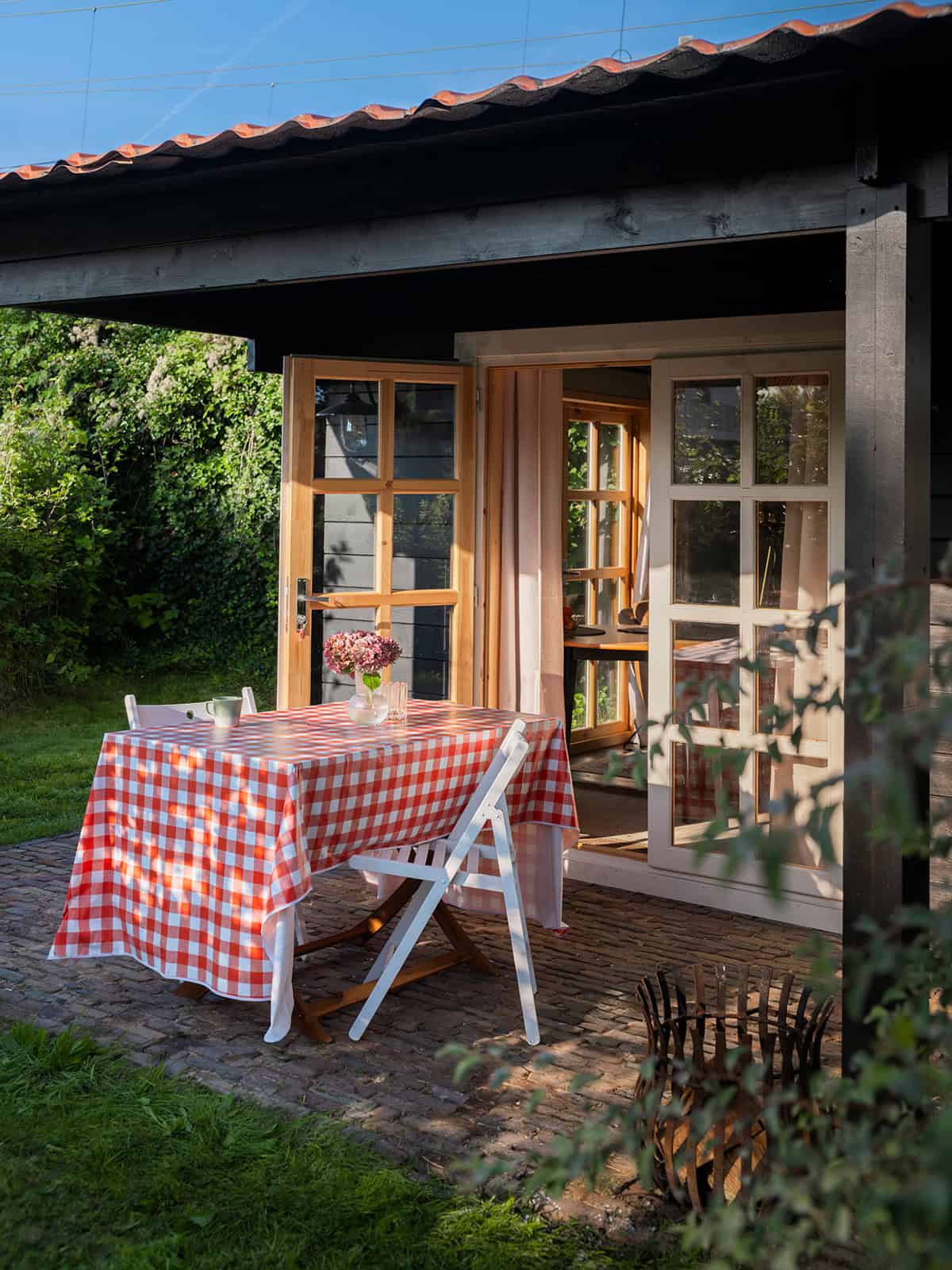 Rustic Covered Patio With Wood Roof And Checkered Table