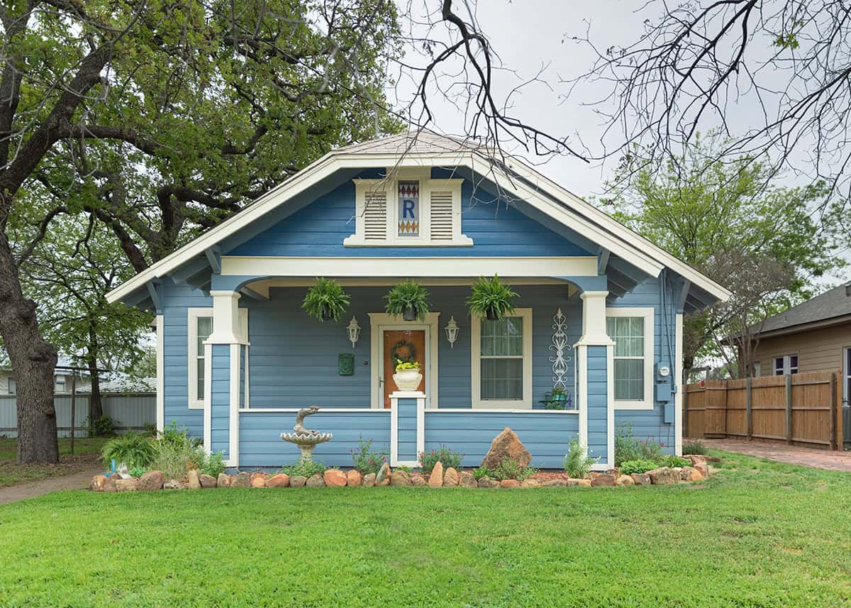 Soft Blue Bungalow Exterior With Welcoming Entry
