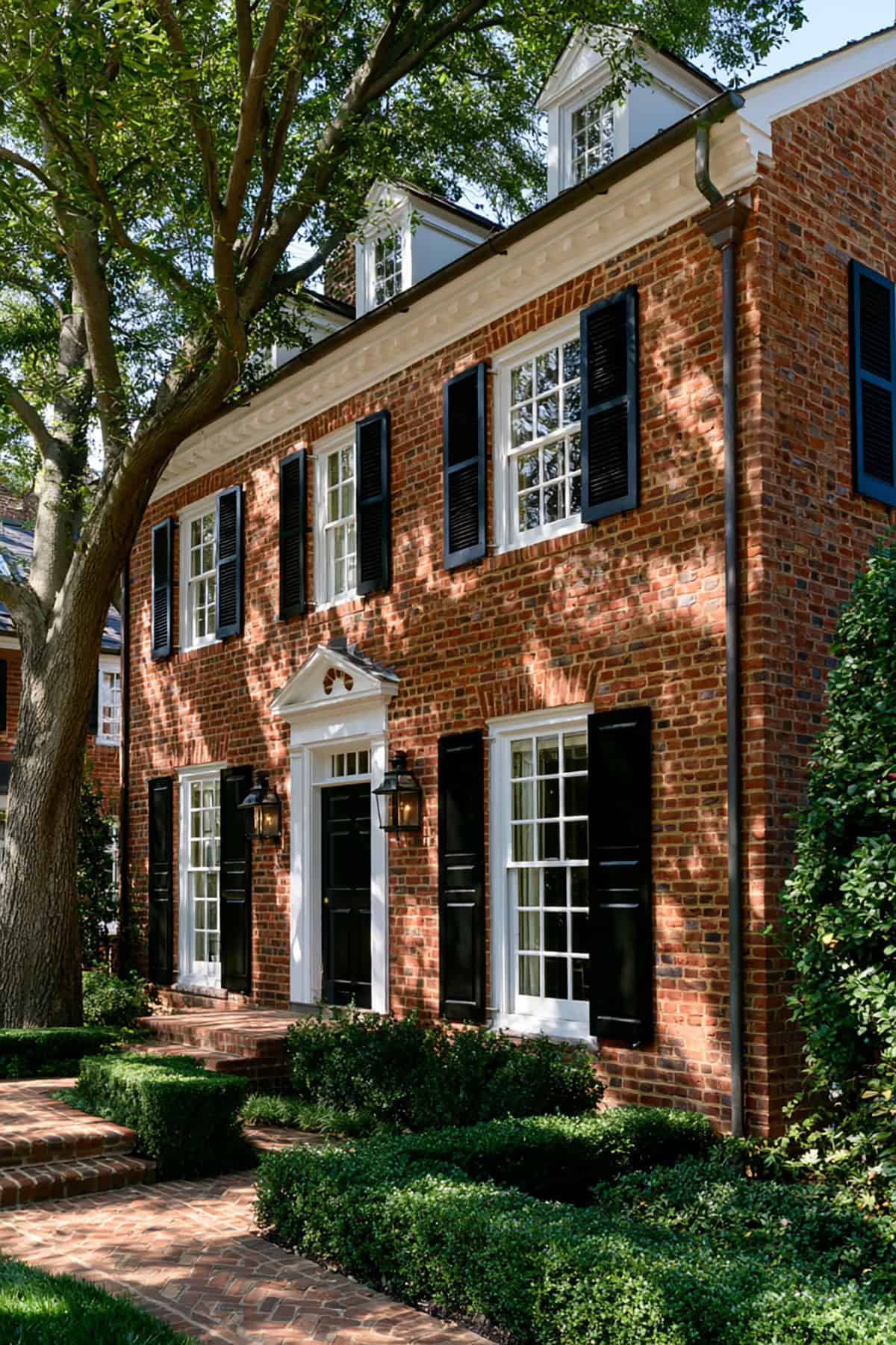 Black Shutters On Traditional Red Brick