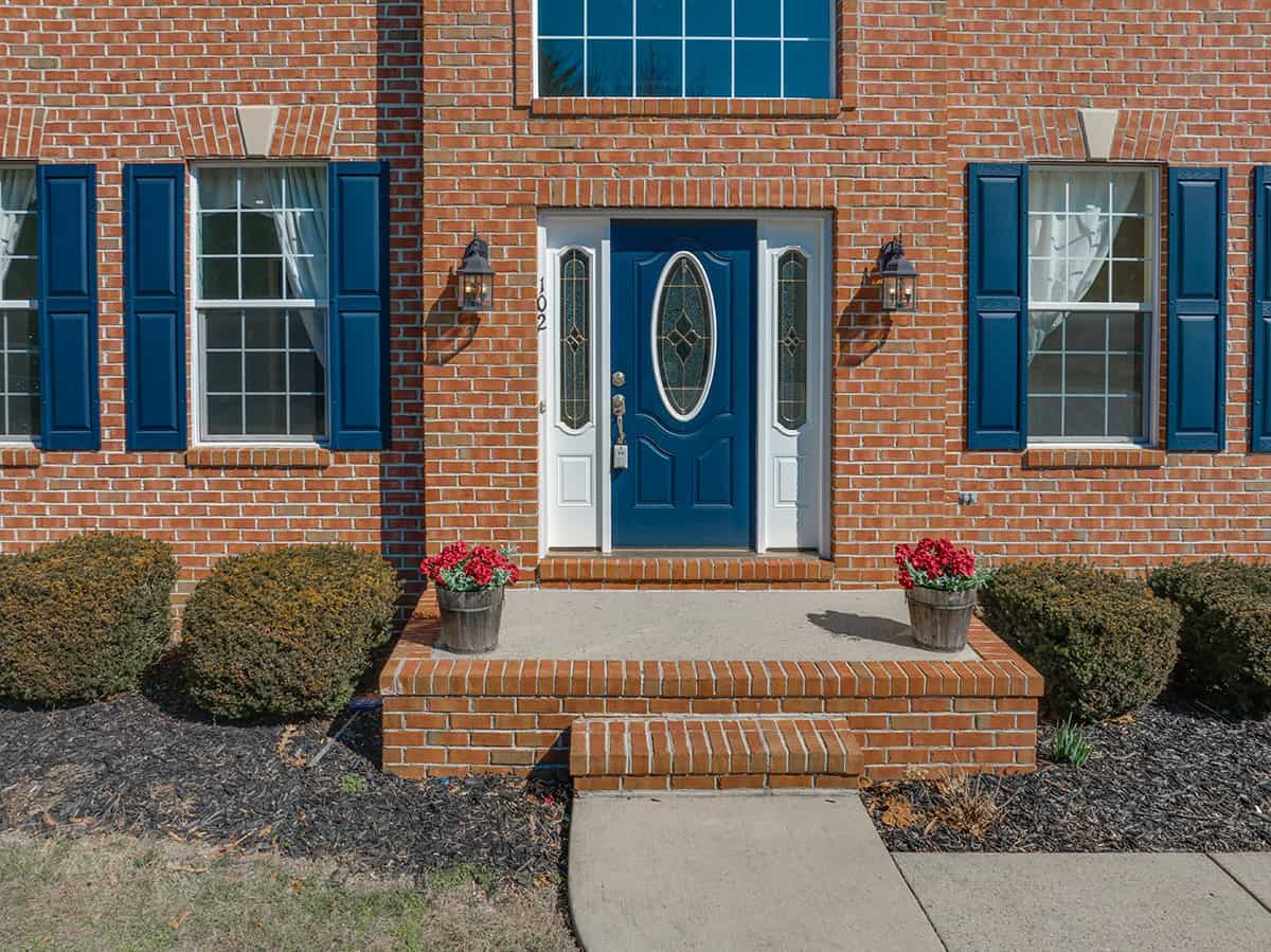 Elegant Blue Shutters on Brick House